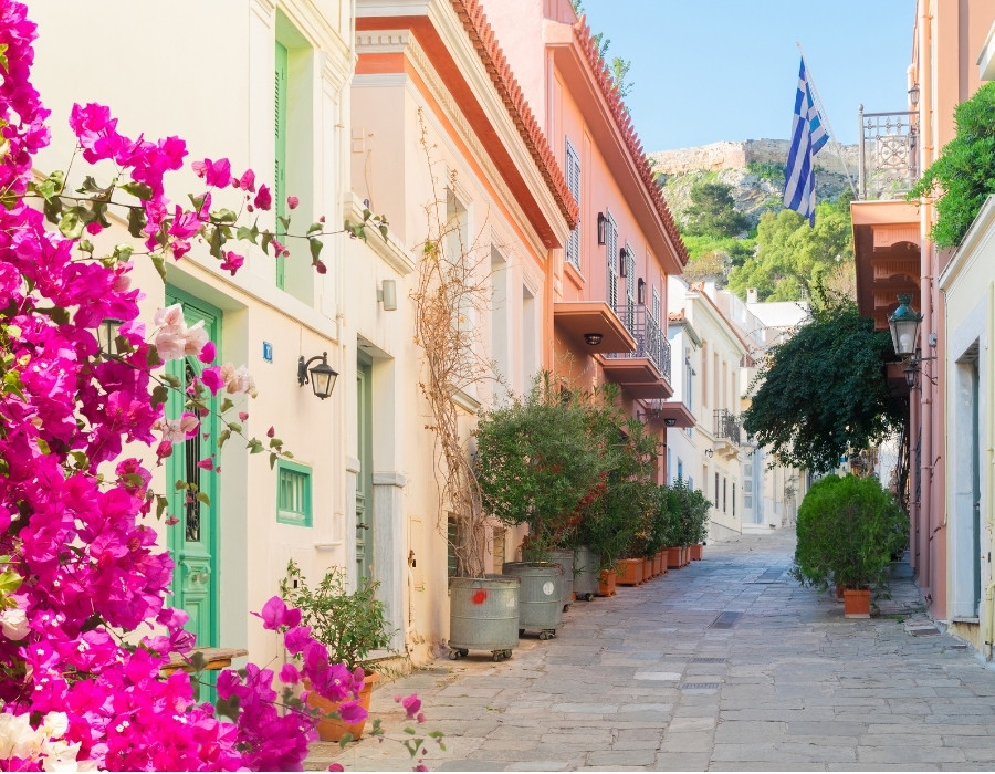 Pink bougainvillea in a colorful laneway in Athens Greece