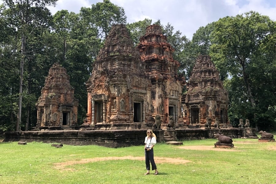 Susan Heinrich at Preah Ko temple in Cambodia during rainy season