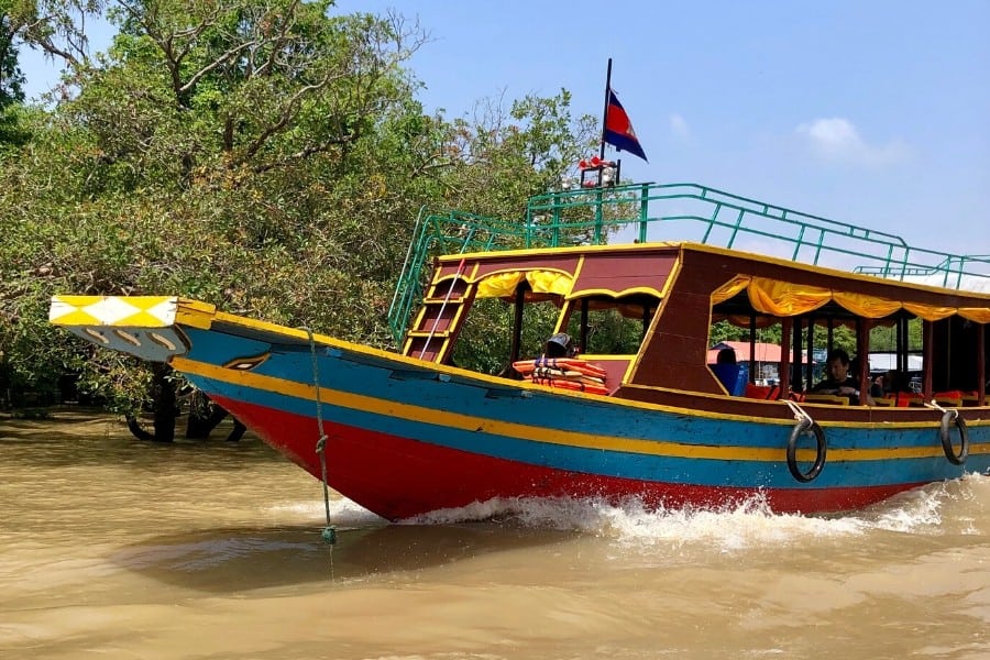 colourful boats tonle sap cambodia