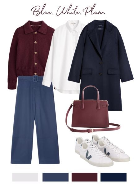 Fall capsule wardrobe items in the color palette: blue, white and plum. Blue trousers, a plum cardigan sweater, white cotton shirt, navy overcoat, white sneakers and a plum handbag.