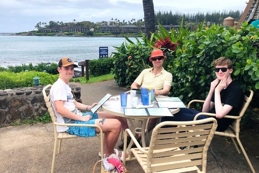 A family enjoys breakfast with an ocean view at Gazebo in Napili Maui