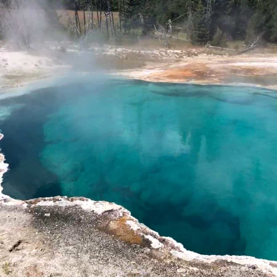 Steam rises from a thermal pool at West Thumb, Yellowstone National Park
