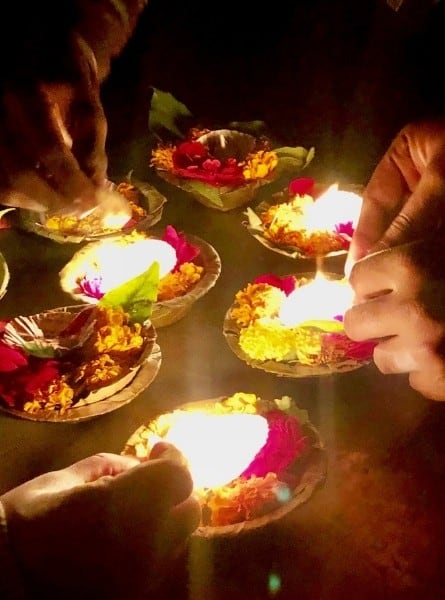 Lighting aarti candles in Varanasi India