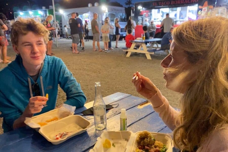 Susan Heinrich and her son Nate eat at a picnic table in theHoopiilani Food Truck Park in Kaanapali Maui