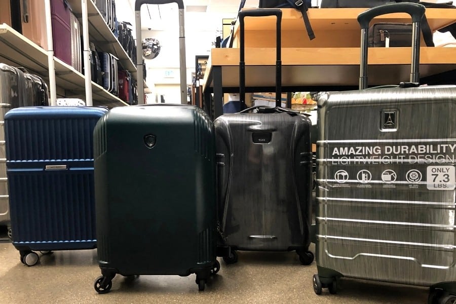 Carry on bags stand next to each other