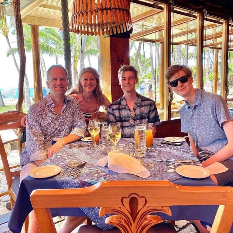Susan Heinrich and her family at a table at Mama's Fish House