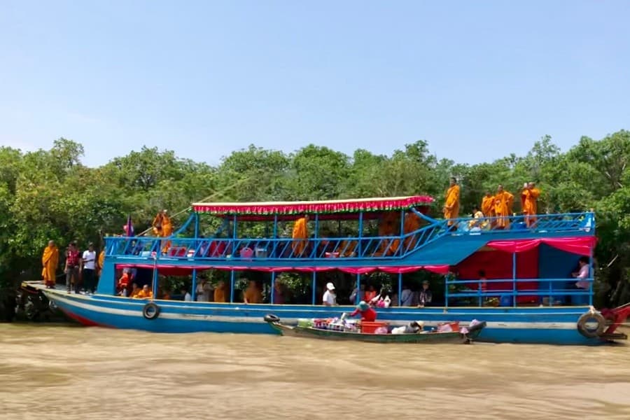 monks on tonle sap river