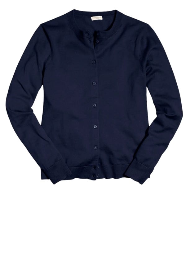 A navy cardigan sweater is a classic addition to any capsule wardrobee
