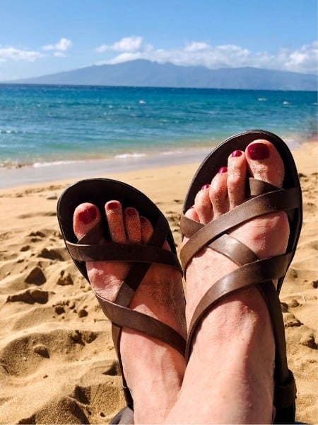 Susan Heinrich wearing her favorite OluKai sandals in Maui, Hawaii