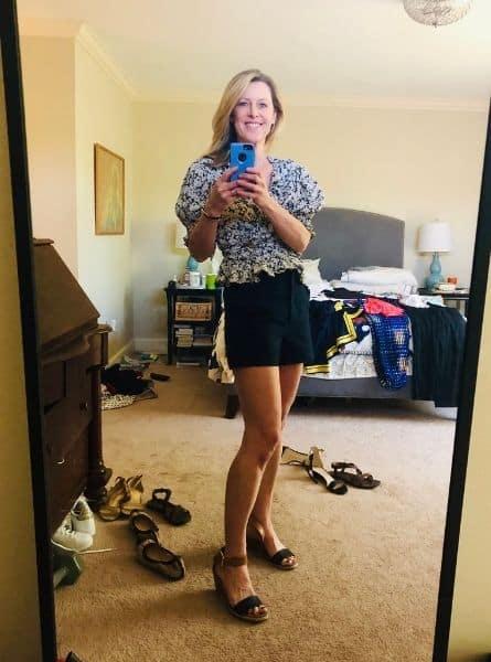 Susan Heinrich trying on her outfits before packing for Paris
