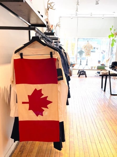 A shop on Queen Street West called 18 Waits with a handmade Canadian flag