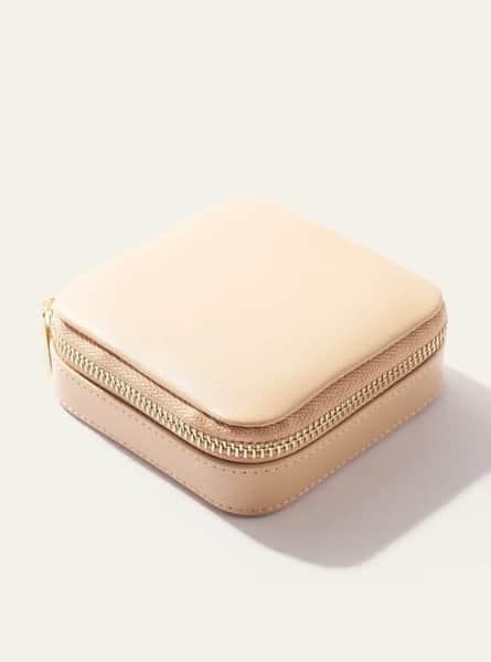 A square travel jewelry case for a holiday gift. Pictured closed with gold zipper. Made by Quince.