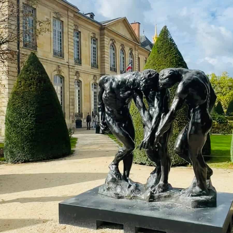 The garden at the Rodin Museum in Paris with Rodin's sculpture, The Three Shades, in the foreground and the beautiful Hôtel Biron building beyond.