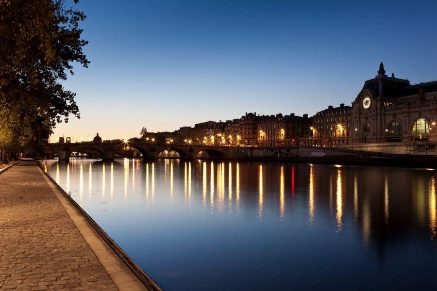 A nightime stroll in Paris along the Seine River across from the Musee D'Orsay