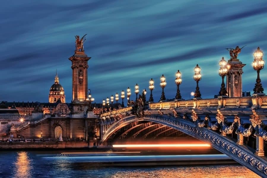 Pont Alexandre bridge over the Seine River in Paris at night