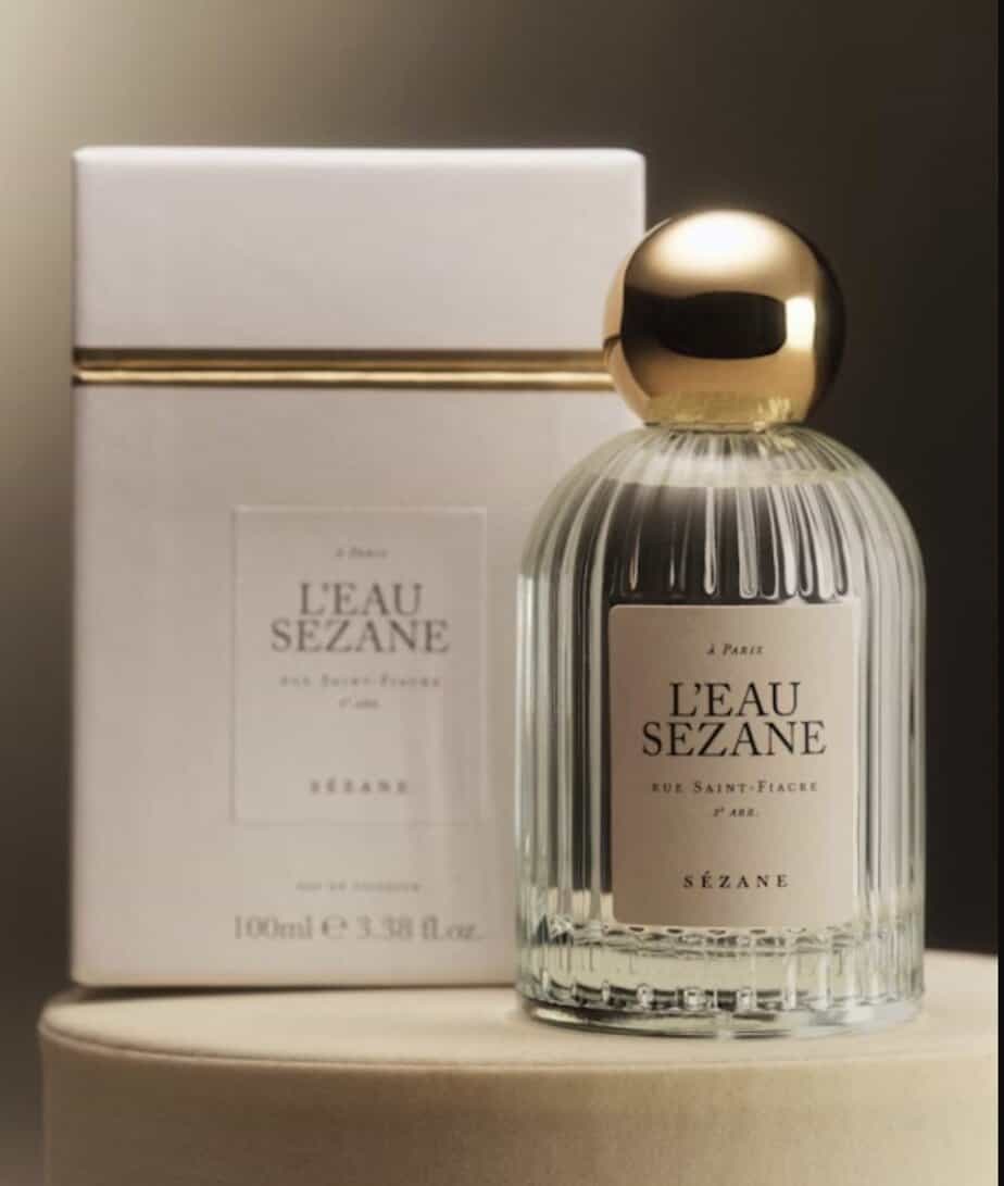 a french perfume bottle next to a box