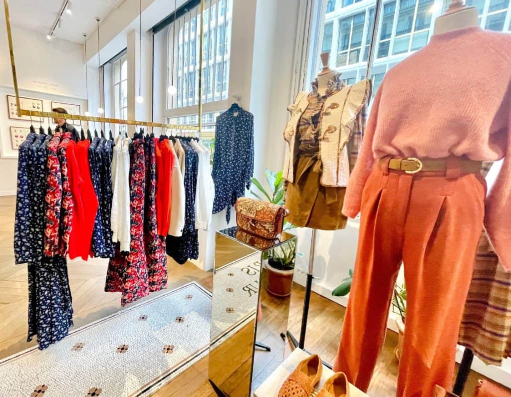 Colorful clothing items are pictured on display in fall at the original Sézane Paris store in the second arrondissement.
