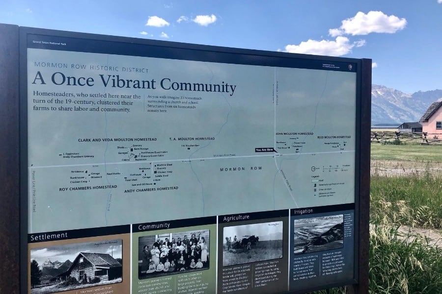 A sign describes the history of the homestead settlements at Mormon Row in Wyoming