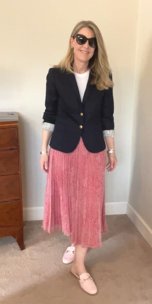 Susan Heinrich wears a maxi skirt and a navy blazer from her spring capsule wardrobe