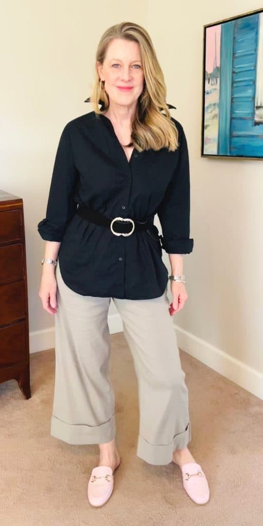 Spring capsule wardrobe evening outfit - light trousers + black shirt and belt