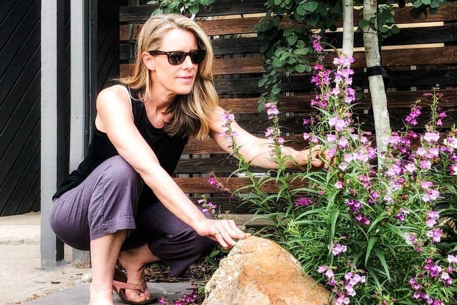 susan in her garden in denver, happy at midlife