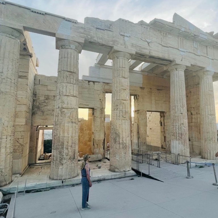 Susan Heinrich looks up at the Porch of the Caryatids at the Acropolis Greece on a solo trip to Athens