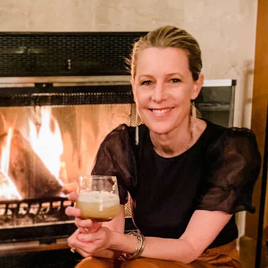 Susan Heinrich wearing earrings by Threads Worldwide