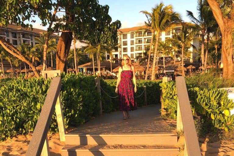 Susan Heinrich walks toward the beach at the Westin Nanea Ocean Villas in Maui