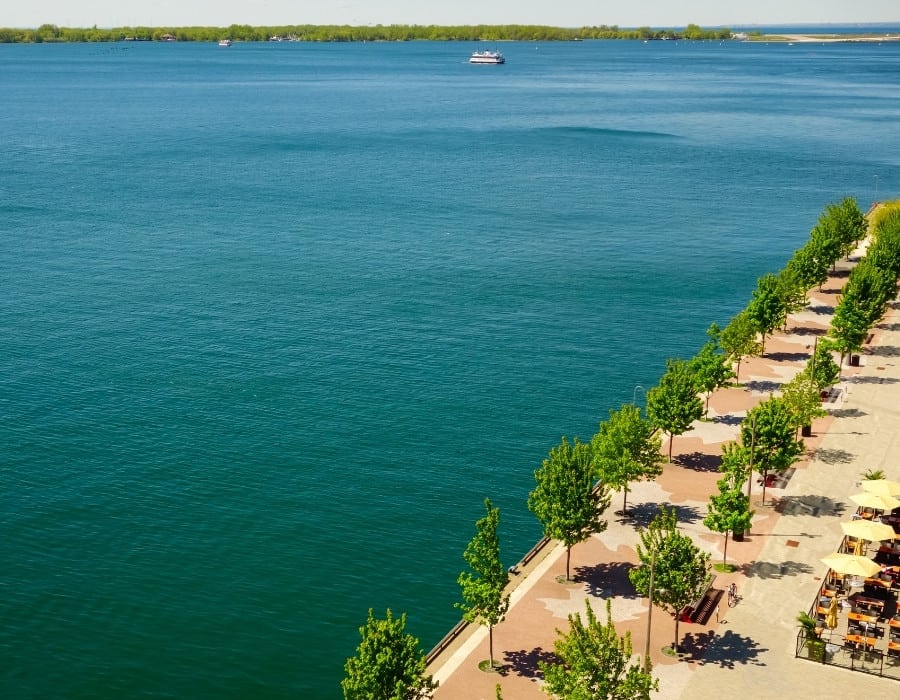 Toronto's harboufront on Lake Ontario with the Toronto islands and a ferry in the distance