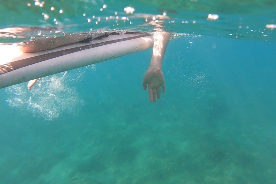 Underwater view a surfboard in the ocean off Kaanapali Beach Maui